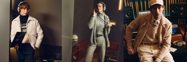 Three individuals are featured in a stylish, music-themed setting, each wearing contemporary outfits from Eleventy. They are engaged in activities related to music, with two men and one woman listening to audio through headphones in what appears to be a recording studio environment