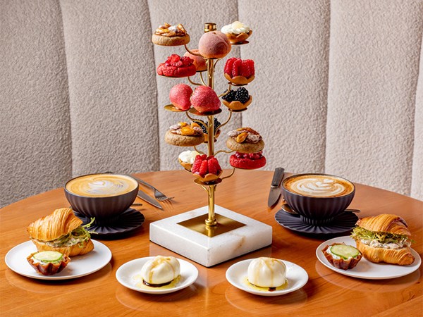 Croissant sandwiches with coffees and tiered Cedric Grolet patisserie